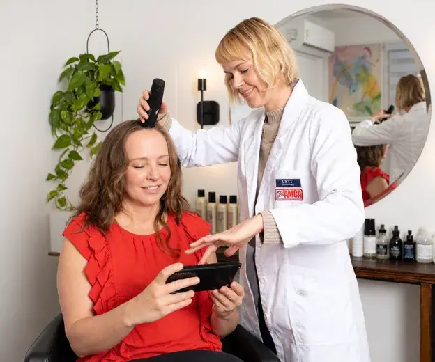 Trichologist consulting with a client about her scalp